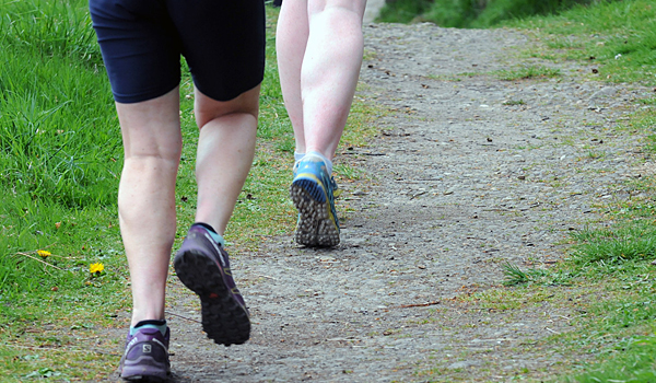 photo of runners in woods